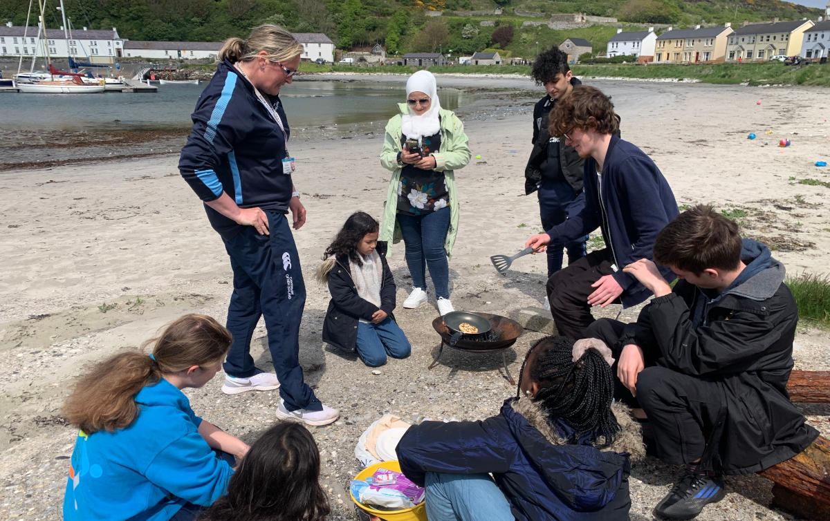Visiting families and islanders share food on Rathlin's beach